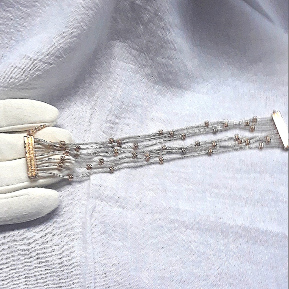🐙 GRAB 3 ITEMS FOR 20% OFF, 7 Strand, Silver & Gold tone bracelet.